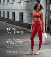 Woman wearing red Lotus Leggings and matching sports bra outdoors. Text: The One She Trusts. Lotus Leggings 30% Off* Selected styles only. T&Cs Apply - Shop Now