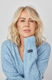 Photo of Lorna Jane Clarkson wearing a light blue knit sweater