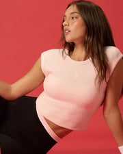 Woman wearing Lorna Jane Activewear shorts and ribbed shirt