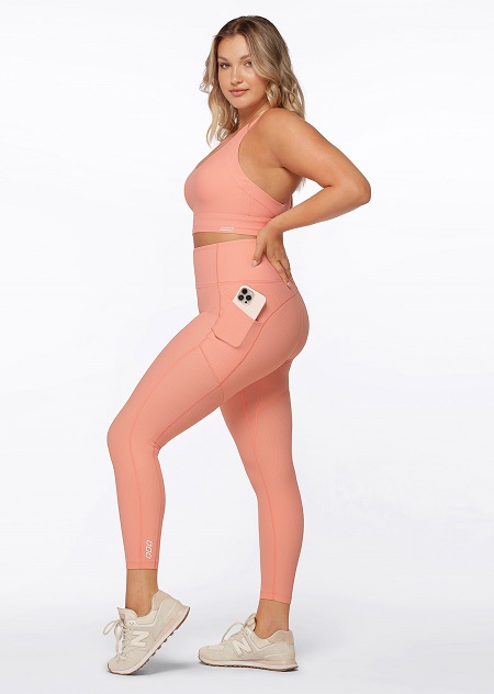 Model Wearing Pink Ribbed Sports Bra and matching Pink Ribbed Booty Support Ankle Biter Leggings