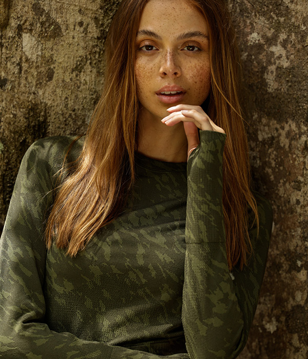 woman wearing a green army print long sleeve tee