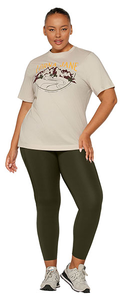 a woman wearing and off white oversized tee and khaki green leggings